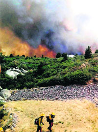 Firefighters move away from the Yarnell Hill fire near Yarnell in Arizona on Sunday. 