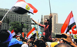 Protesters during a demonstration against Egypts Islamist President Mohammed Mursi in Tahiri Square in Cairo on Monday