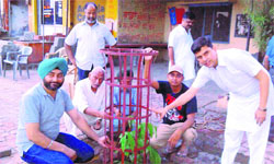 Members of Mission Aagaaz plant a sapling in Amritsar. 
