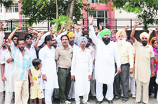 Residents of Talab Neher protest against cancellation of the panchyat election in the village near the district administrative complex in Bathinda on Tuesday.