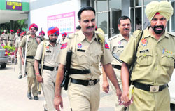 Police parties leave for poll duty in Mohali on Tuesday.