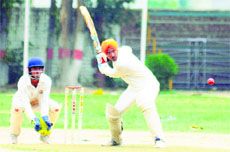 Players in action during a cricket match between the St Attri Cricket Academy and the Chandigarh Cricket Academy at Vivek High School, Sector 38, in Chandigarh on Tuesday.