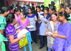 Students fill admission forms at Government Model Senior Secondary School, Sector 20, Chandigarh, on Tuesday