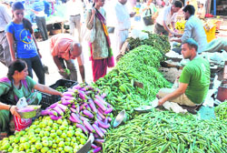 Rush at a vegetable market in Jammu on Tuesday. Tribune photo: Inderjeet Singh