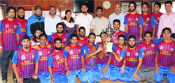 Additional Director General of Police (Armed) S M Sahai with players and officials of the police team in Srinagar on Tuesday. A Tribune photograph