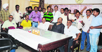 Activists of the Uttariya Railway Mazdoor Union at the Station Superintendents office at the Ludhiana railway station. 