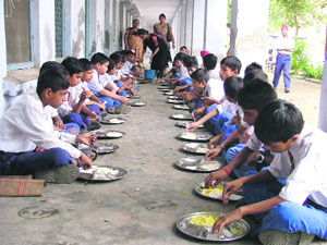 Mid-day meal being served in a school. 