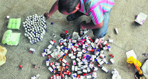A poll official checks ink bottles
