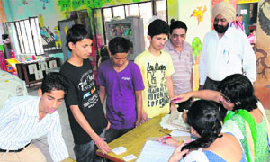 Students deposit admission forms at Government Senior Secondary School in Sector 33, Chandigarh, on Wednesday. 