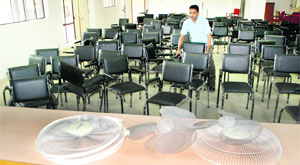 A worker arranges chairs at a hall in the Mini-Secretariat in Panchkula on Wednesday on the eve of the mayoral poll. 