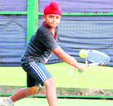 Udday plays a shot during a tennis match at the Chandigarh Club on Wednesday.