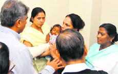 Subhash Kumar, Uttarakhand Chief Secretary, inquires about an infant injured girl found from Gauri Kund at Doon Hospital on Wednesday. 