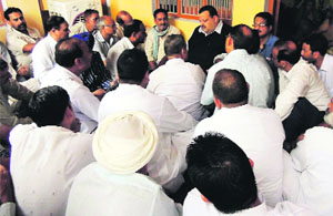 National Conference provincial president Devender Singh Rana visits the residence of ITBP soldier Inspector Bhim Singh at Bobiyan village in Kathua on Wednesday. 