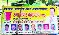 A banner of a migrant candidate contesting panchayat polls at Threeke village