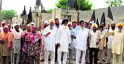Estranged leaders along with supporters protest at Malak village near Jagraon on Wednesday