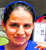 First-time voters Simran Kaur and Amandeep Kaur show their cards