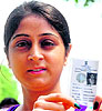 First-time voters Simran Kaur and Amandeep Kaur show their cards