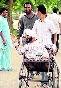 A differently abled man on his way to a polling booth at Kilaraipur village near Mandi Ahmedgarh on Wednesday