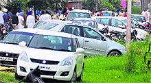 A large number of cars parked outside a polling booth at Threeke village on Wednesday