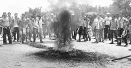 Supporters of the All Koch Rajbongshi Students' Union hold a protest on the second day of the 300-hour economic blockade called over creation of a separate Kamtapur state, in Chirang district of Assam on Wednesday. 