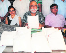 A Rail Cargo official shows the seized contraband.
