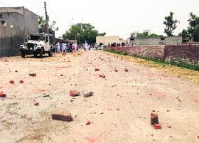 A jeep that was damaged during a clash among supporters of two candidates at Khudian Maha Singh village in Lambi on Wednesday.