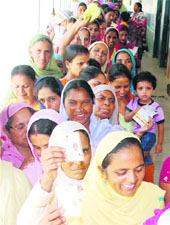 Long queues of voters at Naushera Pannua village in Amritsar on Wednesday. 