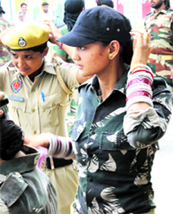 A newly married cop adjusts her cap during a protest dharna at Nandgarh village in Bathinda on Thursday.