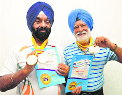 Local veteran athletes, advocate Gurjivan Singh Sidhu and his younger brother Pargat Singh Sidhu, with their medals won in the recently held 34th National Masters Athletics Championship at Bengaluru.