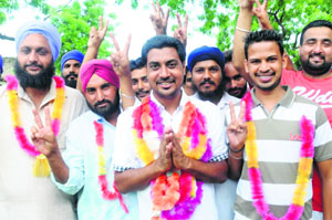 A youngster, Randhir Singh, who was elected sarpanch, with his supporters at Chappar Chhiri Kalan village in Mohali on Thursday.