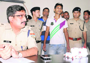 Dehradun SSP Kewal Khurana presents the murder accused at a press conference in Dehradun on Thursday. 