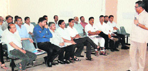 An HIPA official gives tips to district officials at a meeting in Hisar. 