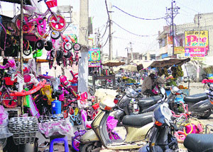 Goods kept on display by shopkeepers on the railway road in Kaithal.  
