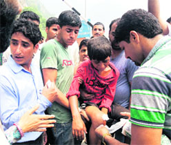 an injured child is administered first aid in Reasi on Thursday. 