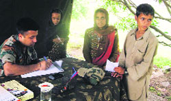 Patients being examined at a medical camp in Rajouri on Thursday. 