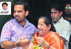 The inconsolable mother of Tarun (inset) in Ludhiana on Thursday. Photo: Inderjeet Verma