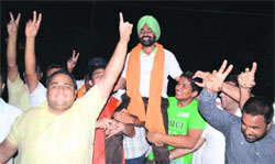 Pritpal Singh, who was elected the sarpanch of Phoolanwal village, with his supporters in Ludhiana on Thursday. Photo: Inderjeet Verma