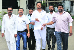 Members of the Valmiki community come out of the Police Commissioners office in Ludhiana on Thursday. Photo: Inderjeet Verma