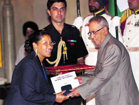 President Pranab Mukherjee honours Tilling Yam of Arunachal Pradesh in New Delhi on Thursday.