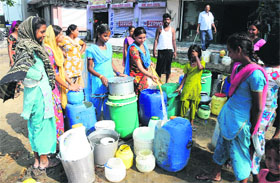 Women queue up to fill water in Bathinda on Friday. 