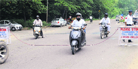 A rope attached to mobile barricades, fixed by the traffic police as part of its security drill for Vice-President M Hamid Ansari's visit to the PGI, scheduled for Saturday, poses a threat to two-wheeler riders.