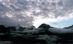 A view of clouds hovering over Mussoorie hills taken by Tribune lensman Vinod Pundir from Dehradun on Friday