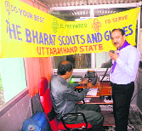 A Bharat Scout and Guides volunteer manages a Ham Radio in Dehradun on Friday. 