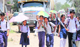 Children come out after school hours in Jammu on Friday.