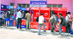 Customers buy SIM cards in Jammu on Friday.