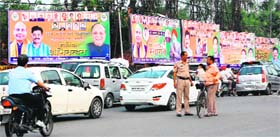 BJP hoardings at Crystal Chowk ahead of the visit of party president Rajnath Singh in Amritsar on Saturday