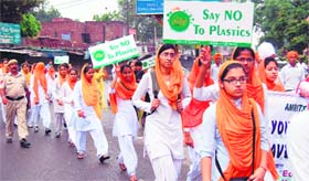 Students take part in a procession to mark the Foundation Day celebrations in Amritsar on Saturday