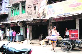 Shopkeepers vacate their shops near the Jallianwala Bagh in Amritsar on Saturday
