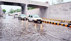 A view of the inundated railway under bridge on the Bathinda-Mansa road after the light rain on Saturday