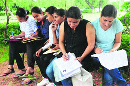 Students fill in admission forms at the PU in Chandigarh on Saturday. 